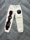 Saint Vanity sweatpants cream/ red logo